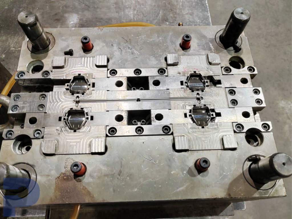 PICA Manufacturing Solutions injection molding, producing high-precision parts for automotive, consumer goods, electronics, and medical devices, including components like dashboards, connectors, and syringes