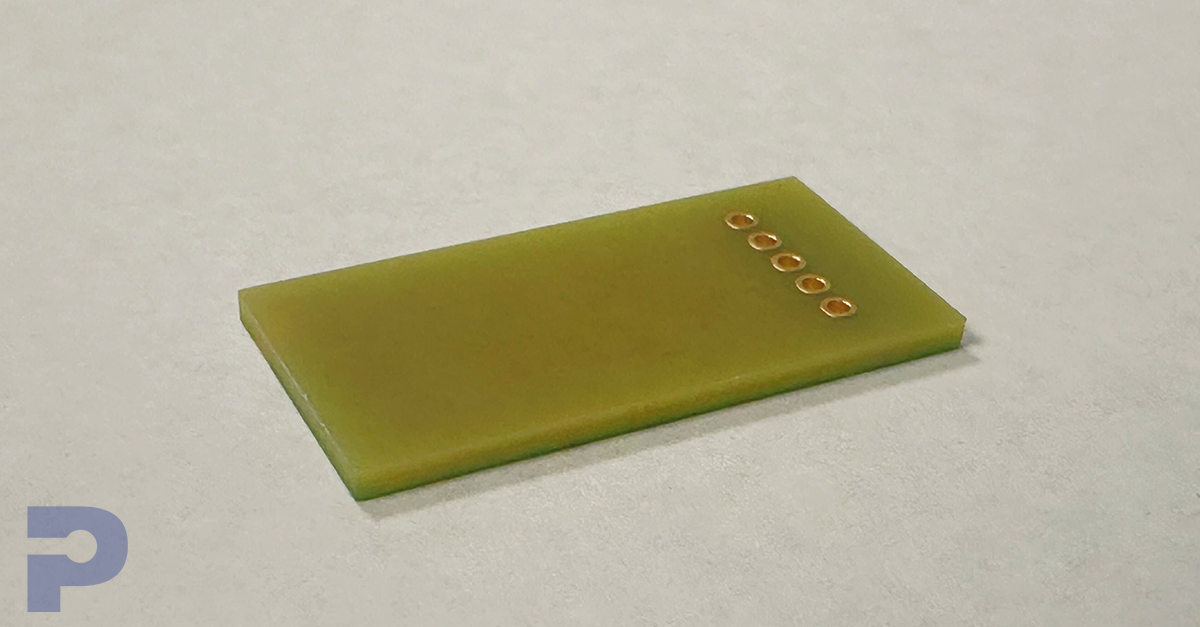 Image of the base material of a printed circuit board: thin yellowish rectangle.