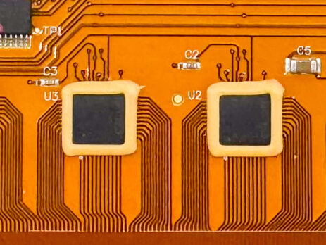 Image of flex pcb with a epoxy around the chip solder joints