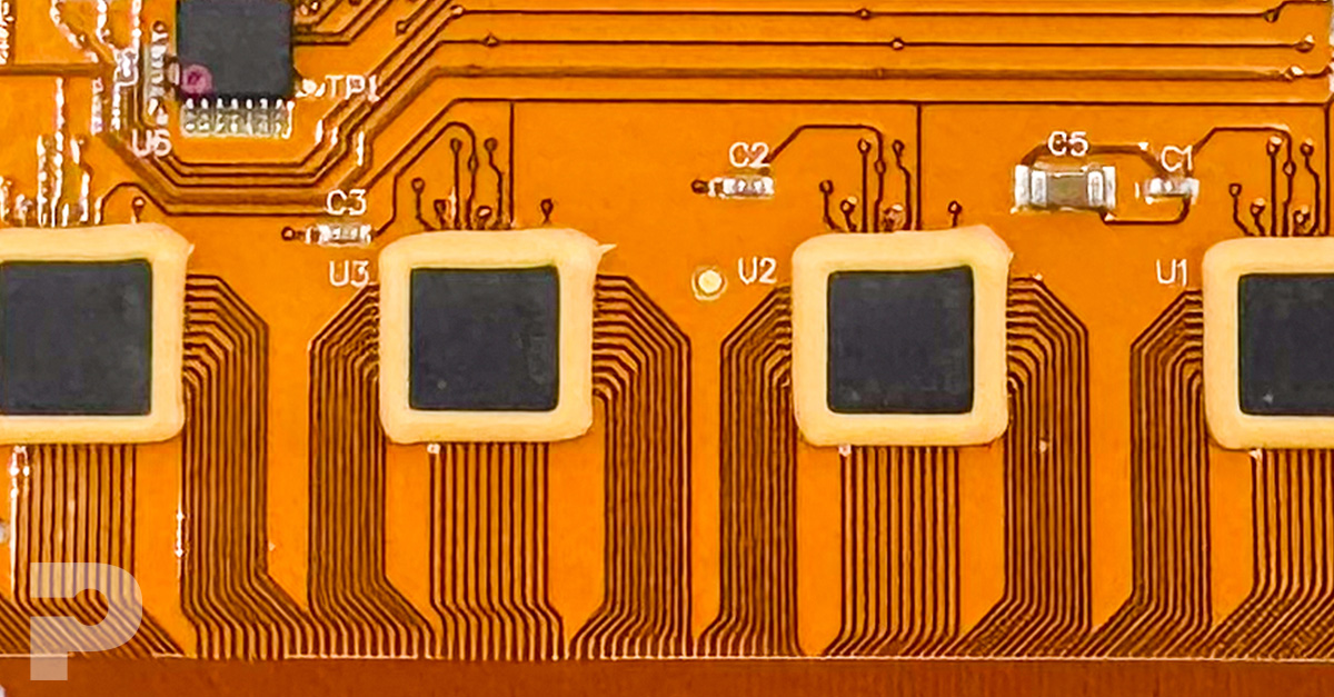 Image of flex pcb with a epoxy around the chip solder joints