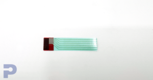 Small rectangular piece of flex circuitry with silver traces