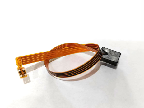 Flexible circuitry with a molded end cap coiled up