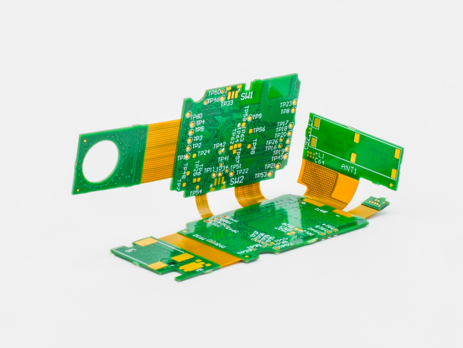 Rigid-flex PCB assembly featuring green circuit boards connected by flexible copper interconnects.